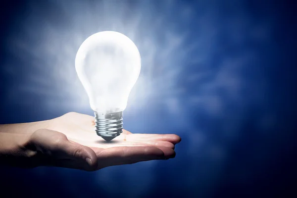 Light bulb in hand — Stock Photo, Image