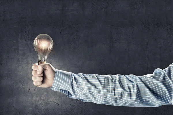 Light bulb in hand — Stock Photo, Image