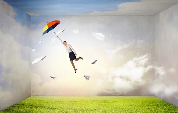 Woman fly on umbrella — Stock Photo, Image