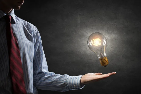 Bulb in hand — Stock Photo, Image