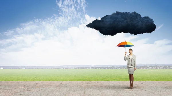Businesswoman with umbrella — Stock Photo, Image