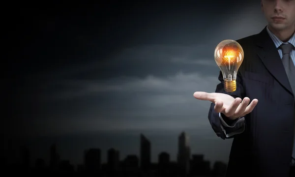 Bulb in hand — Stock Photo, Image