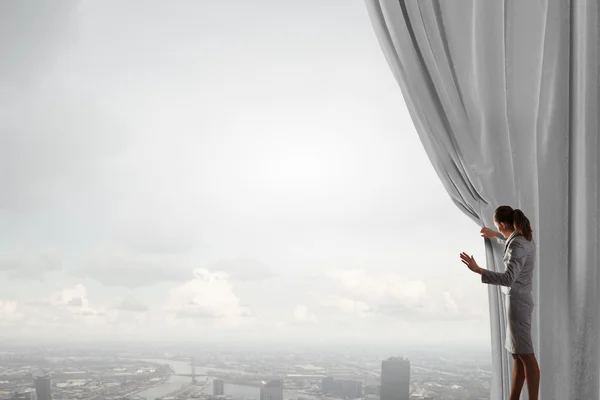 Woman open curtain — Stock Photo, Image