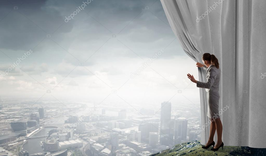 Woman open curtain