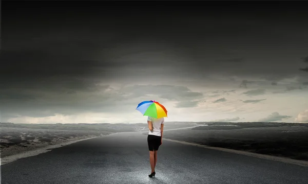 Businesswoman with umbrella — Stock Photo, Image