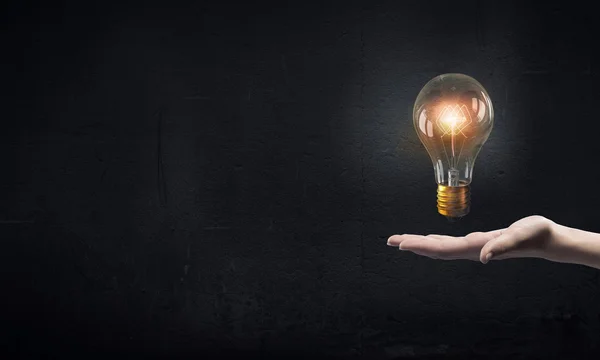 Bulb in hand — Stock Photo, Image