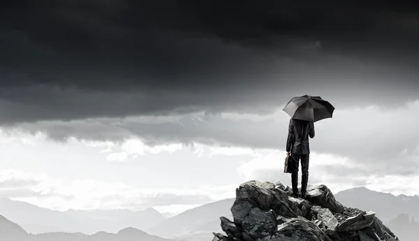 Businessman with umbrella — Stock Photo, Image