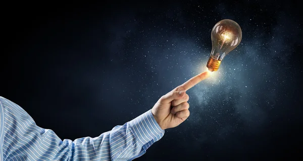 Light bulb in hand — Stock Photo, Image