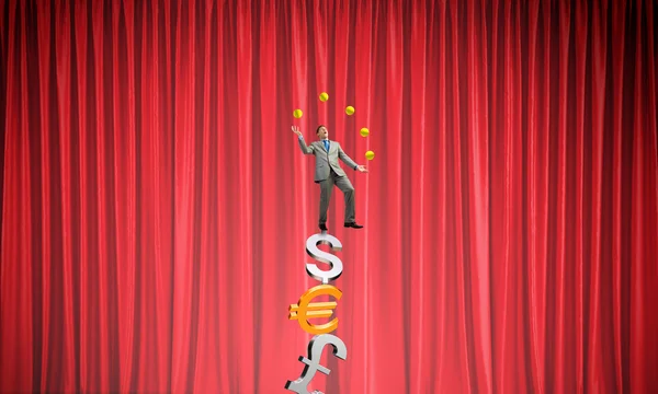 Businessman juggling with balls — Stock Photo, Image