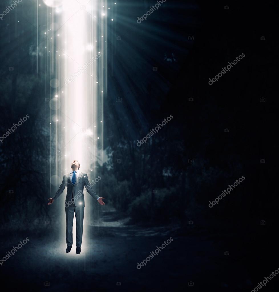 Man standing in light Stock Photo by ©SergeyNivens 85001936