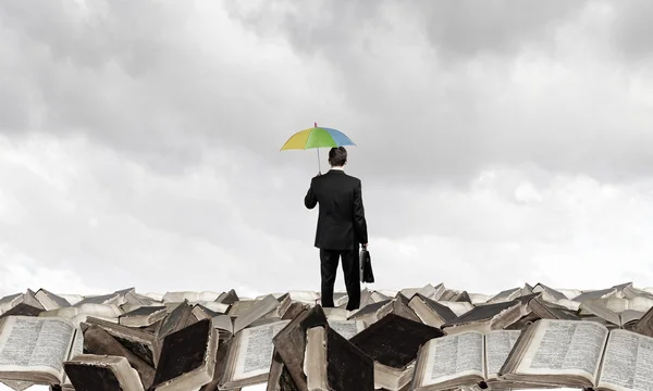 Businessman with umbrella — Stock Photo, Image