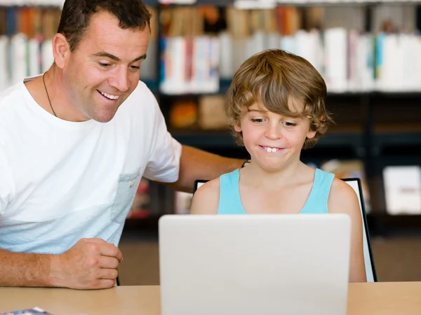 Little boy and his father with laptop — Stock Photo, Image