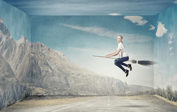 Girl fly on broom — Stock Photo, Image