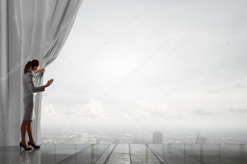 Woman open curtain