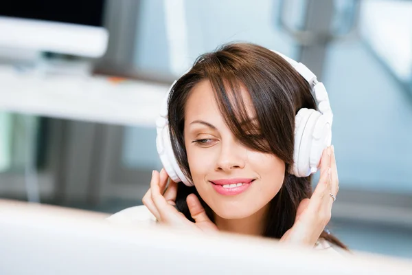 Woman in headphones — Stock Photo, Image