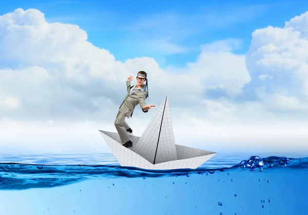 Businesman on paper boat — Stock Photo, Image