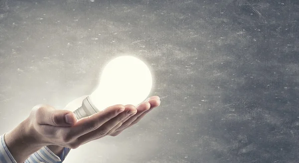 Light bulb in hand — Stock Photo, Image