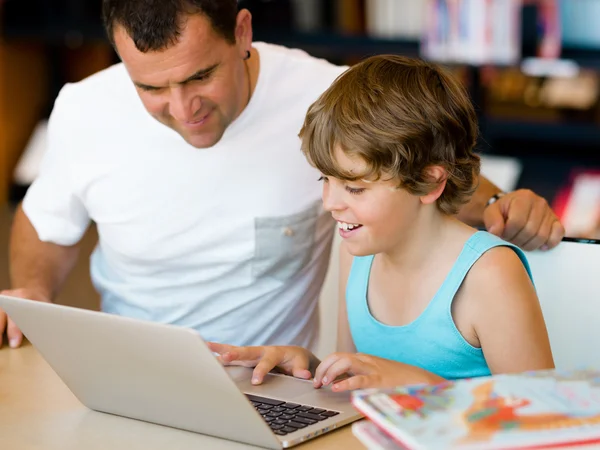 Little boy and his father with laptop — Stock Photo, Image