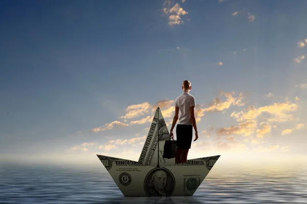 Woman in dollar boat — Stock Photo, Image