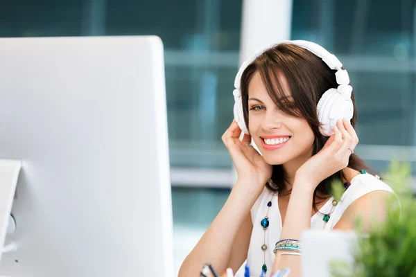 Woman in headphones — Stock Photo, Image