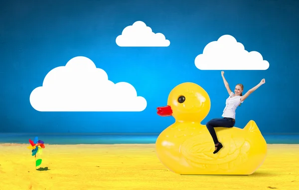 Businesswoman on rubber duck — Stock Photo, Image