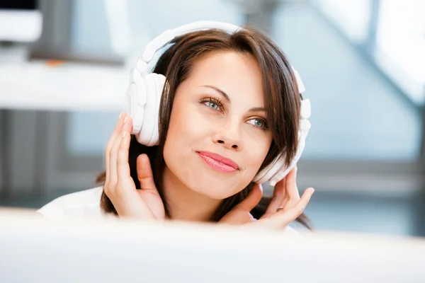 Woman in headphones — Stock Photo, Image