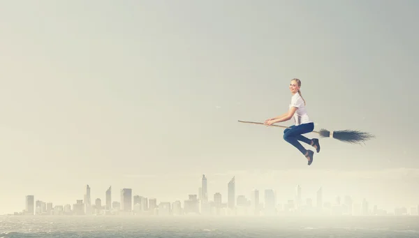 Girl fly on broom — Stock Photo, Image