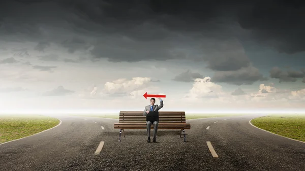 Businessman on bench — Stock Photo, Image