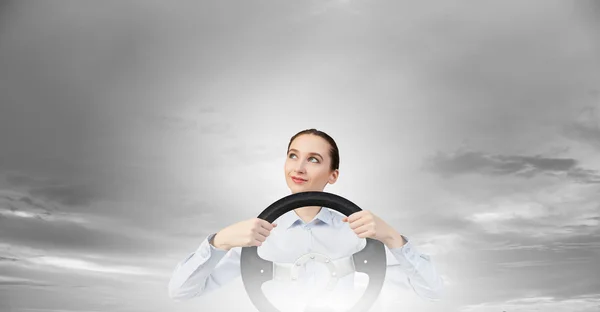 Woman with steering wheel — Stock Photo, Image