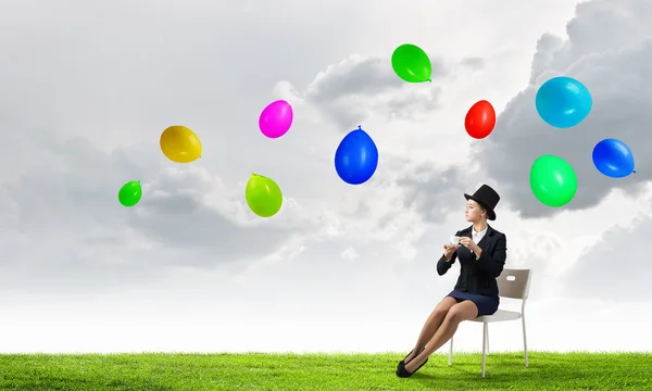 Girl in black cylinder — Stock Photo, Image