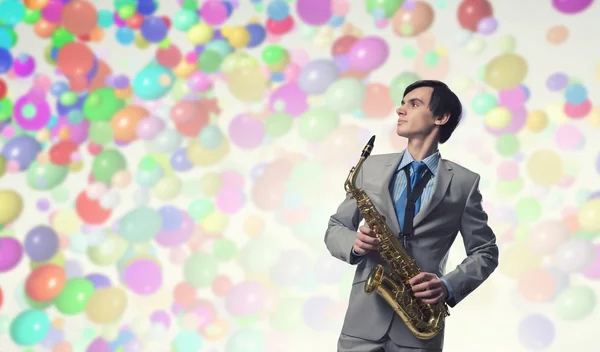 Handsome saxophonist. Concept image — Stock Photo, Image