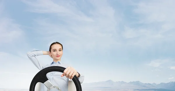 Woman with steering wheel — Stock Photo, Image