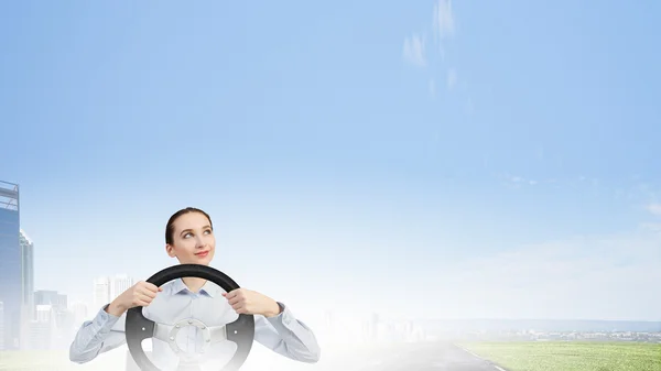 Woman with steering wheel — Stock Photo, Image