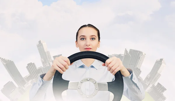 Woman with steering wheel — Stock Photo, Image