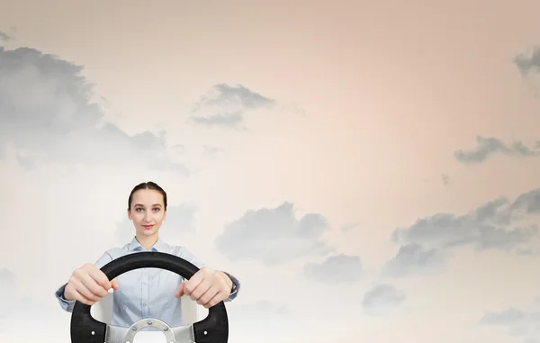 Woman with steering wheel — Stock Photo, Image