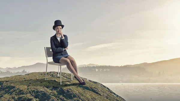 Girl in black cylinder — Stock Photo, Image