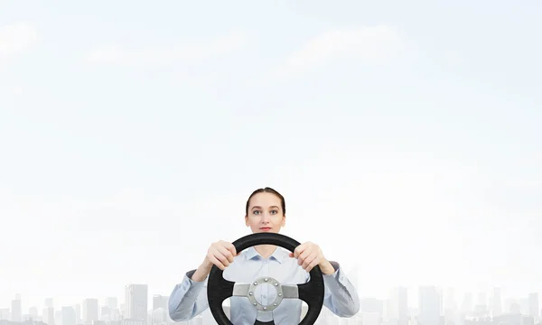 Woman with steering wheel — Stock Photo, Image