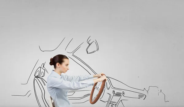 Woman with steering wheel — Stock Photo, Image