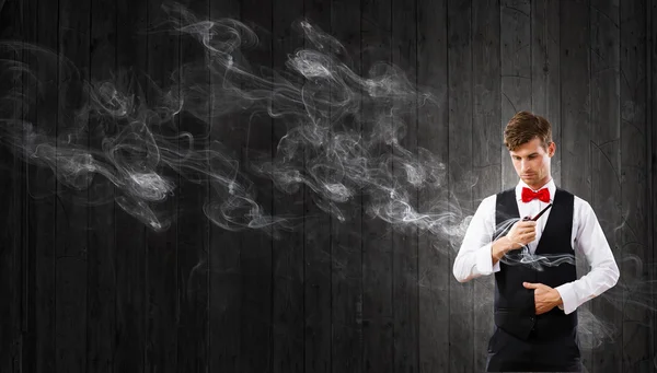 Businessman and pipe smoke — Stock Photo, Image