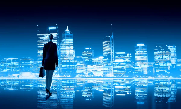 Businesswoman and night city — Stock Photo, Image