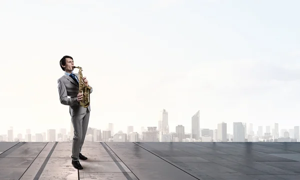 Handsome saxophonist. Concept image — Stock Photo, Image