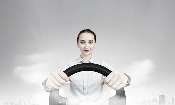 Woman with steering wheel — Stock Photo, Image