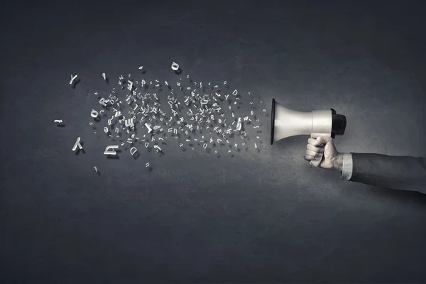 Megaphone in hand — Stock Photo, Image