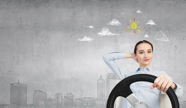 Woman with steering wheel — Stock Photo, Image