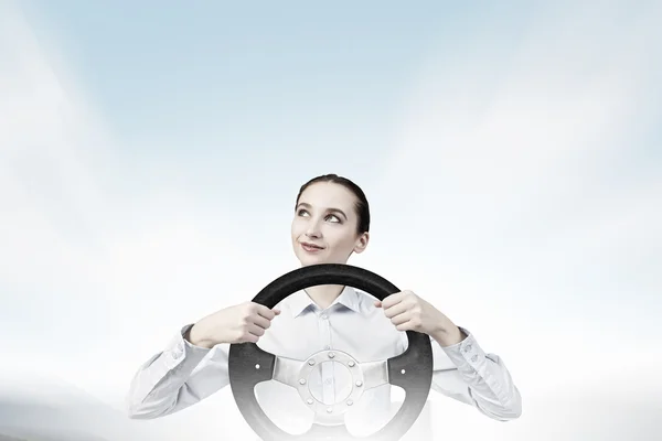 Woman with steering wheel — Stock Photo, Image