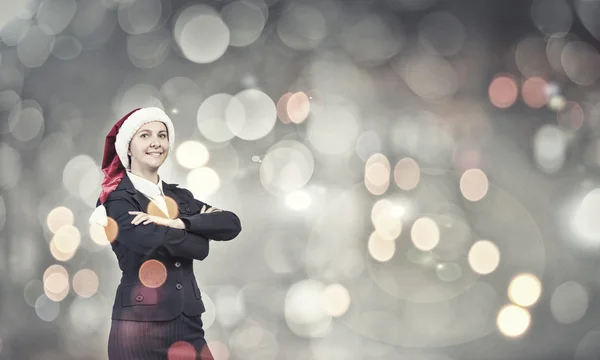 Mujer de negocios en sombrero de santa —  Fotos de Stock