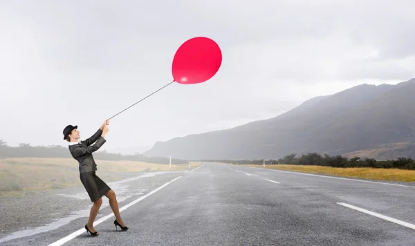 Woman fly on balloon — Stock Photo, Image