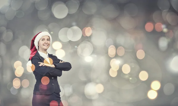 Mujer de negocios en sombrero de santa —  Fotos de Stock