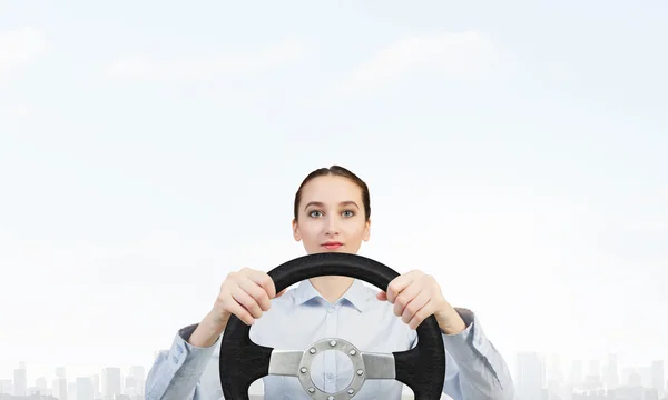 Woman with steering wheel — Stock Photo, Image