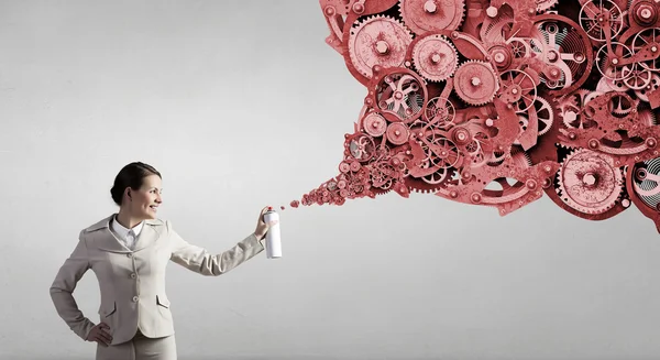 Woman spray gears — Stock Photo, Image